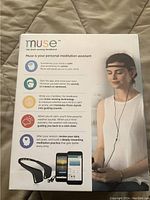Front of retail box with Muse branding, product name and illustration of headband on model