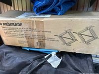 Boxed pair of Pro Grade RV stabilizer jacks with specifications and product details visible on packaging.