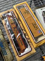 Life-Like powered locomotive and Union Pacific boxcar in yellow boxes