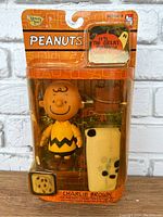 Front view of the Peanuts Charlie Brown Halloween action figure in original packaging showing figure, accessories, and Halloween-themed card