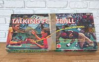 Box top of Talking Football game showing colorful football action scene and game title.