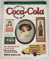 Front cover of the Coca-Cola reference book showing vintage Coca-Cola images and title.