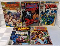 Five Marvel What If comic books laid out showing covers and titles.