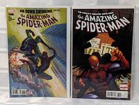 Photo showing front covers of two Spider-Man comic books, including Issue #798 with Spider-Man and a villain on a rooftop and another comic with Spider-Man breaking through a wall.