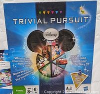 Front of the Walt Disney Trivial Pursuit family board game box showing Disney characters and branding