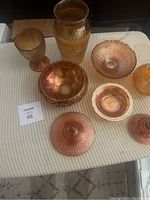 Overview of all marigold carnival glass items on display