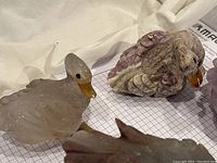 Light green carved glass duck figurine with faceted decorative feather detail