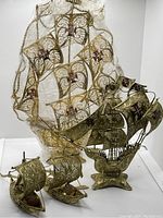 Three filigree Spanish Armada ships displayed together showing scale differences and intricate detailing throughout.