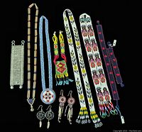 Full display of 11 vintage hand beaded Native art jewelry pieces against black background showing various necklaces, earrings, and bracelets in multicolor beadwork.