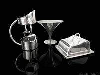 Three vintage silverplated serve ware pieces including horse bit wine pourer, tapered compote dish, and covered butter dish on reflective black surface.