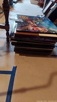 Stack of LaserDisc covers topped by Toy Story