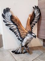 Front view of hand-painted osprey wall hanging showing detailed feathers and realistic colors.