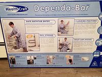 Back side of box showing main features such as safe bathtub entry, rail storage, toilet side support, and 5 locking positions.