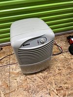 Front-facing photo of the Kenmore dehumidifier showing the control knob and front vents.