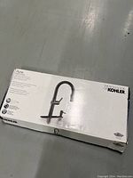 Boxed Kohler Rune faucet packaging showing faucet image and branding