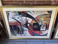 Frontal view of the large abstract framed print showing the entire artwork with the gold frame and cream matting.