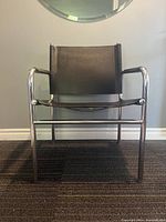 Front view of chrome frame and leather sling seat and back