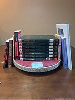 Front view of 10 history books on Canadian history including 6 volumes of Horizon Canada series, displayed upright and flat on a round tray.