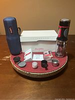 Full lot including espresso maker, accessories, instruction manuals, carry case, and original box