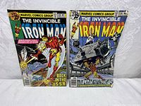 Two vintage Iron Man comic books: Issue #116 showing Iron Man flying with text Back in the USSR, priced at 35 cents.