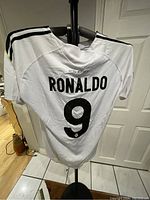Back of white Real Madrid football shirt with 'Ronaldo' name and number 9