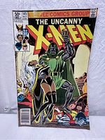 Front cover of The Uncanny X-Men comic book Vol 1, issue 145, May 1981, showing Doctor Doom holding Storm.