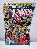 Front cover of The Uncanny X-Men #129 comic showing main characters and title.