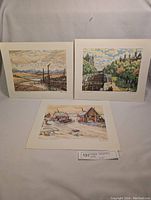 Set showing all three prints by Nicholas Hornyansky laid out on white fabric background.