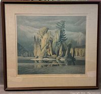 Framed print showing landscape artwork with reflections in water, natural tones, matted and framed.