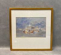 Framed print of boats in front of the Dogana and Santa Maria Della Salute in a light wooden frame against a gray background.