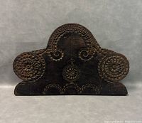 Front view of vintage large wooden carved ornamental art piece showing detailed floral and leaf carvings with dark stain finish.