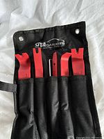 Set of five car door panel and dash removal tools in black carrying pouch with GTA CarKits branding.