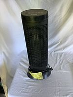 Front view of the black Honeywell electric heater showing grille and digital controls on top.