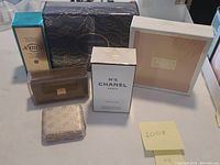 Six boxed fragrances displayed on tabletop