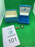 Photo showing cameo ring, earrings and Birks box with auction lot card