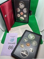 Both 1981 and 1982 Canadian Proof Sets displayed, showing coins and leather cover on 1981 set