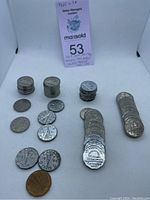 Multiple stacks and loose Canadian nickels showing beaver and caribou designs from 1929 to 1969.