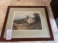 Full view of framed David Cox painting showing landscape with church ruin, figures, and trees.
