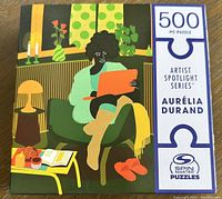 Front box image showing puzzle artwork and branding details.