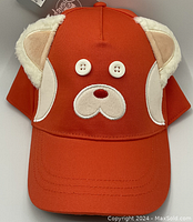 Front view of the bright orange youth baseball hat with attached fabric ears and embroidered red panda face.