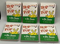 Photo of six new Dr. Seuss 'Hop On Pop' hardcover board books arranged in two rows of three, showing front covers facing up with bright illustrations and titles.