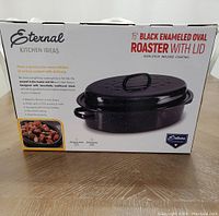 Photo of the boxed 15-inch Eternal Kitchen Ideas Black Enameled Oval Roaster with Lid showing product branding, features, and package condition.