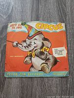 Front cover of the children's vinyl record titled "Let's Go To The Circus", featuring a cartoon circus elephant and colorful circus-themed design.