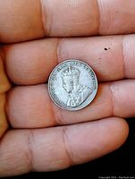 Obverse side of the 1924 Canadian 5 cent nickel showing King George V portrait and inscriptions.