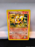Close-up of the front of Blaine's Growlithe Pokemon card showing artwork, stats, and details with yellow border and fire-themed background.