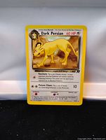Front image of a Dark Persian Pokemon card with 60 HP, yellow border, and Team Rocket branding.