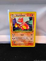 Clear photo of Charmeleon base set card in plastic sleeve featuring card details and artwork.