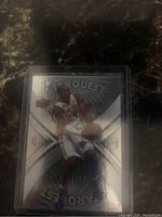 Front of Kobe Bryant StarQuest foil card showing image of Kobe in Lakers jersey holding basketball.