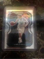 Front of LaMelo Ball rookie basketball card showing player in action with prizm reflective design.