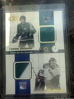 Front side of the card showing patches of Teemu Selanne (San Jose Sharks) and Guy Herbert (New York Rangers) with player photos and team logos.
